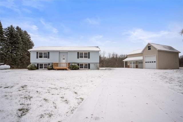 raised ranch featuring an outbuilding and a garage