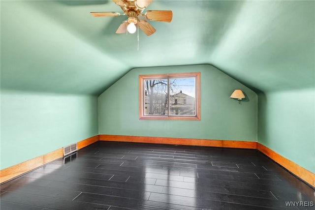 bonus room with dark hardwood / wood-style floors, ceiling fan, and lofted ceiling