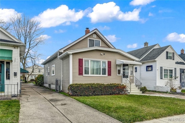 bungalow with a front lawn