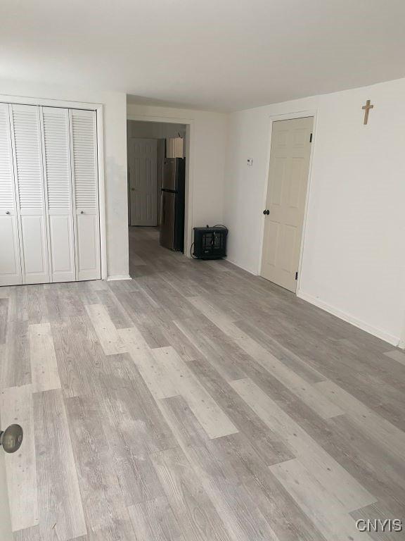 unfurnished living room with light wood-type flooring