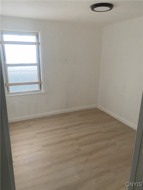 unfurnished room featuring light hardwood / wood-style flooring