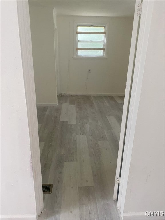 corridor featuring hardwood / wood-style flooring