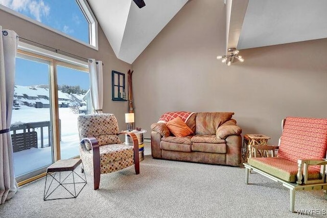 living room with carpet flooring, a mountain view, high vaulted ceiling, and beam ceiling