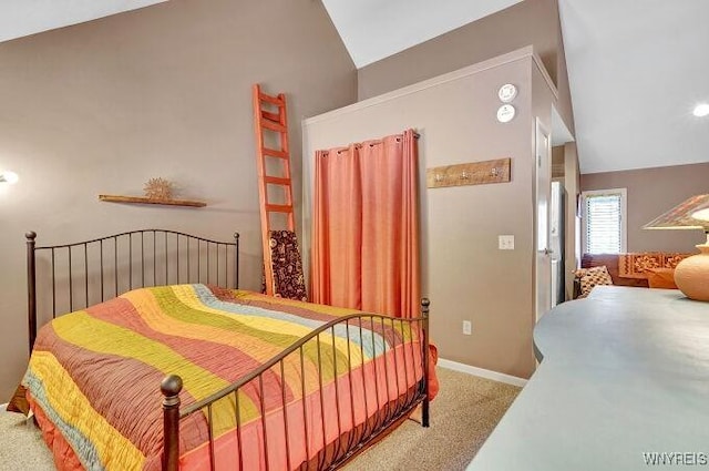 carpeted bedroom with vaulted ceiling