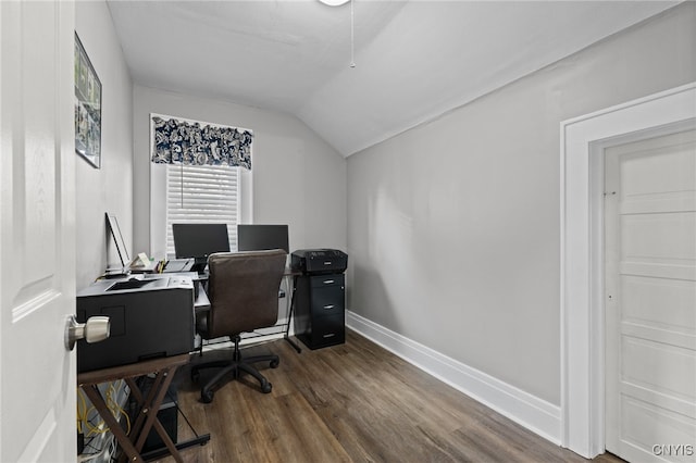 office space with vaulted ceiling and dark wood-type flooring