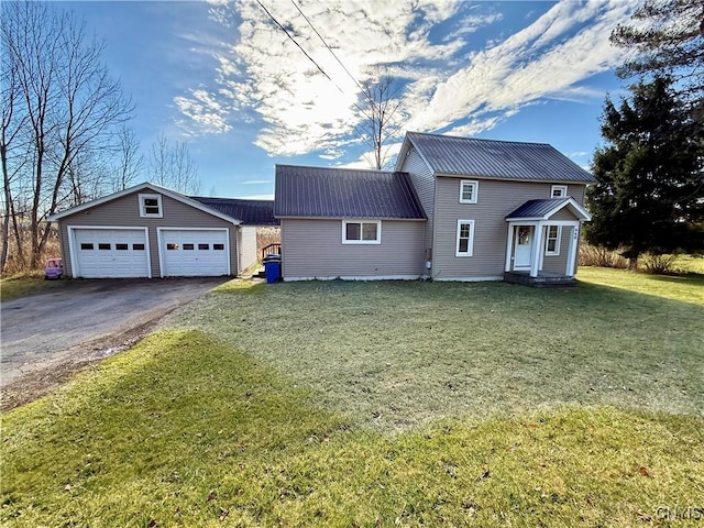 view of front facade featuring a front yard and a garage