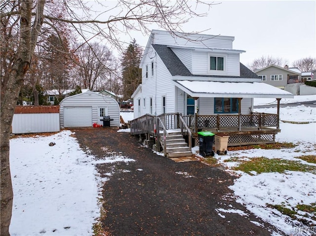 exterior space featuring a garage and an outbuilding