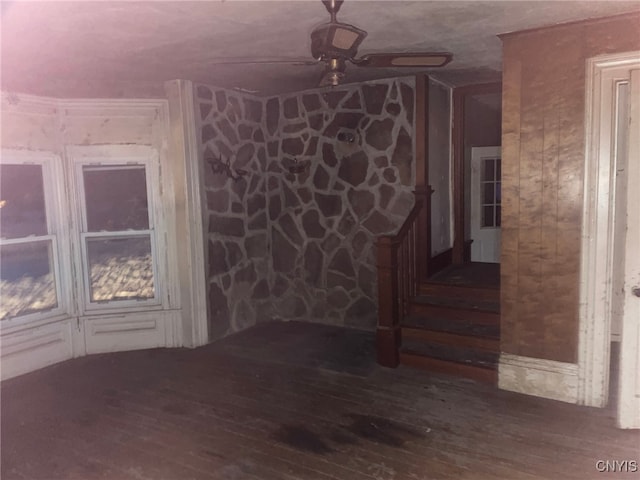 spare room featuring ceiling fan and wood-type flooring