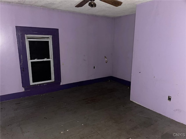 spare room featuring ceiling fan and a textured ceiling