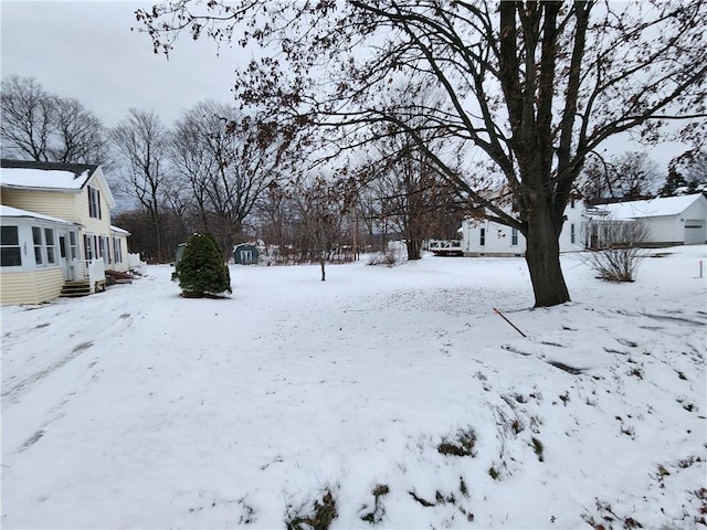 view of yard covered in snow