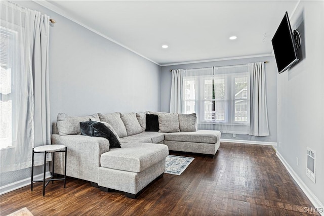 living room with dark hardwood / wood-style floors and ornamental molding