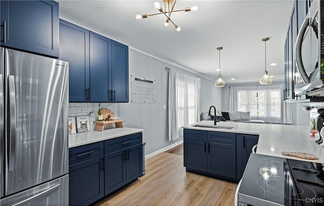 kitchen featuring light hardwood / wood-style floors, sink, stainless steel appliances, and blue cabinets