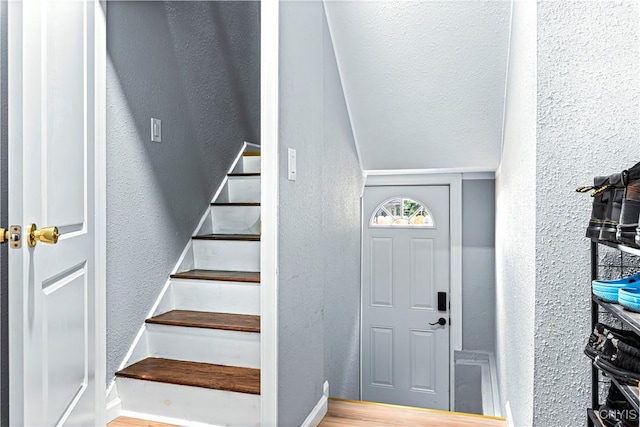 foyer entrance with hardwood / wood-style floors