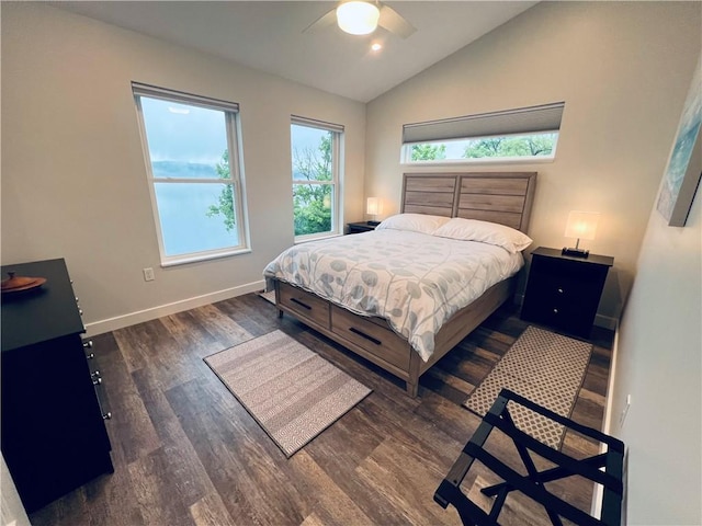 bedroom with dark hardwood / wood-style flooring, ceiling fan, and lofted ceiling