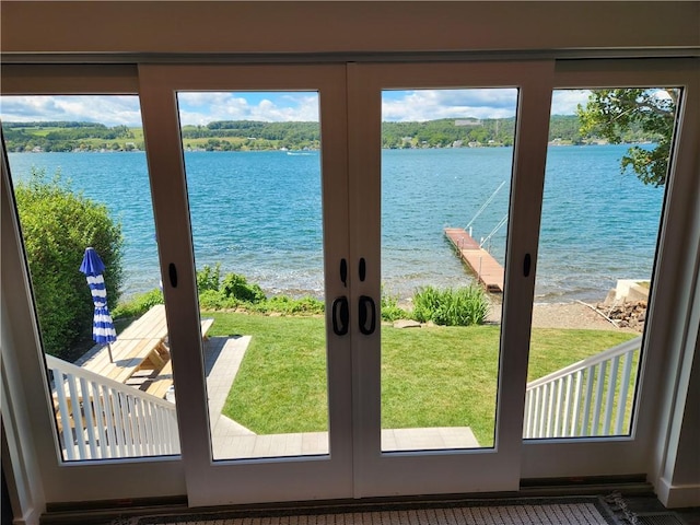 doorway with french doors and a water view