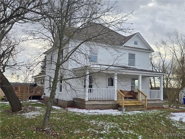 view of front of home featuring a yard and a porch