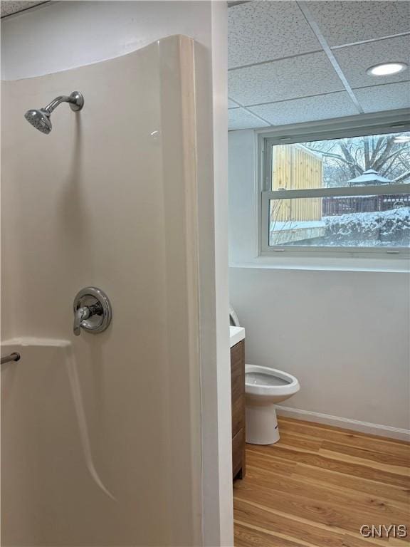 full bathroom with vanity, toilet, baseboards, walk in shower, and wood finished floors