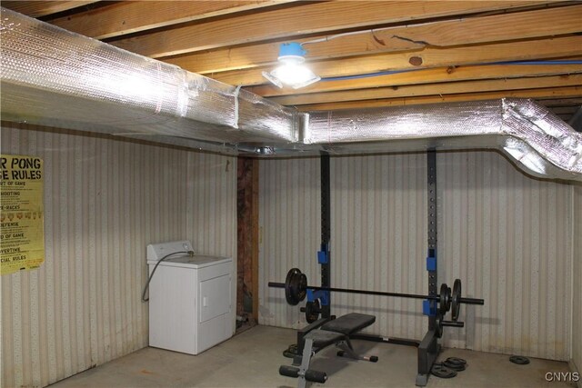 basement featuring washer / dryer and wallpapered walls