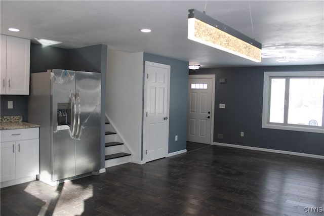interior space featuring stairway, recessed lighting, dark wood-type flooring, and baseboards