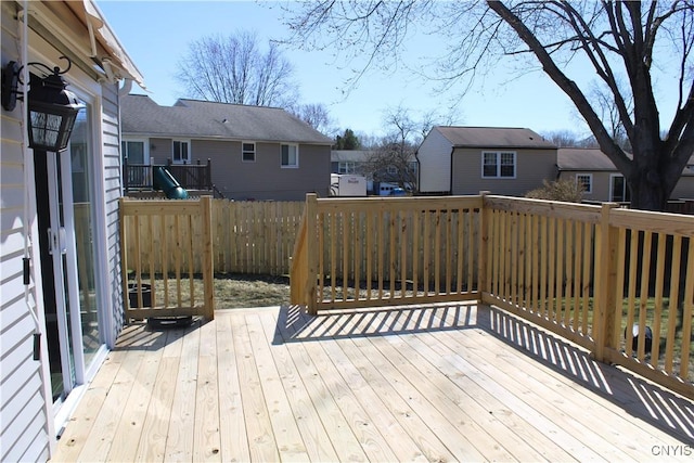 wooden terrace featuring a residential view