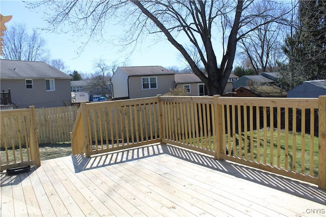 wooden deck featuring fence and a residential view