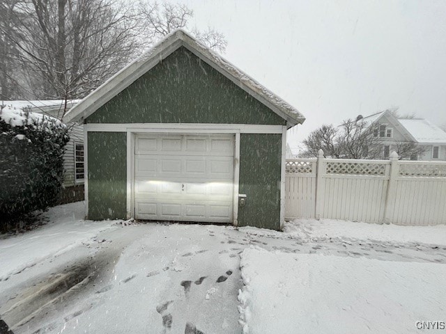 view of snow covered garage