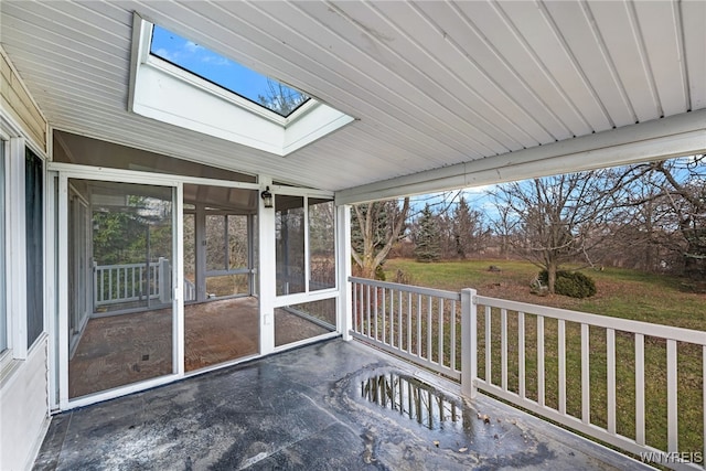 unfurnished sunroom featuring a healthy amount of sunlight and lofted ceiling