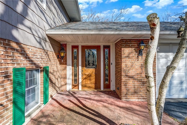 property entrance with a garage