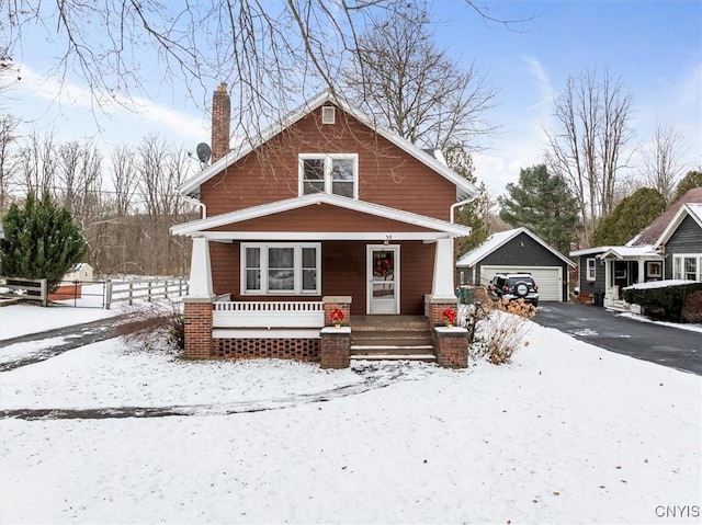 view of front of home with an outdoor structure and a garage