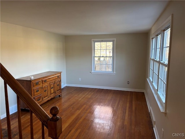 unfurnished room featuring dark hardwood / wood-style flooring