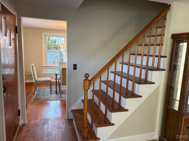 staircase featuring hardwood / wood-style flooring