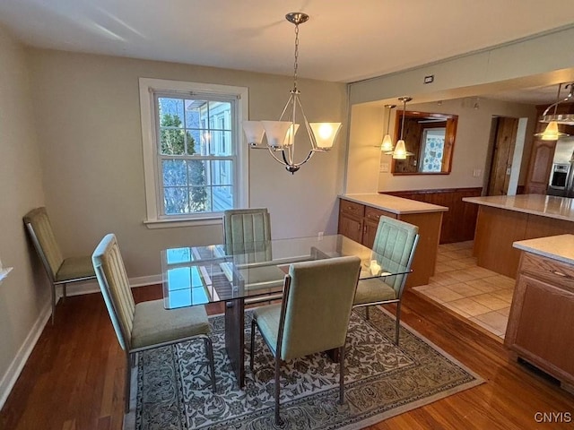 dining room featuring a notable chandelier and hardwood / wood-style flooring