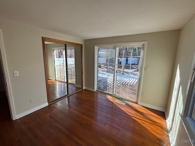 interior space with dark hardwood / wood-style flooring