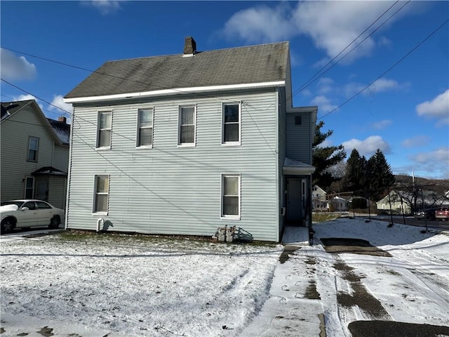 view of snow covered property