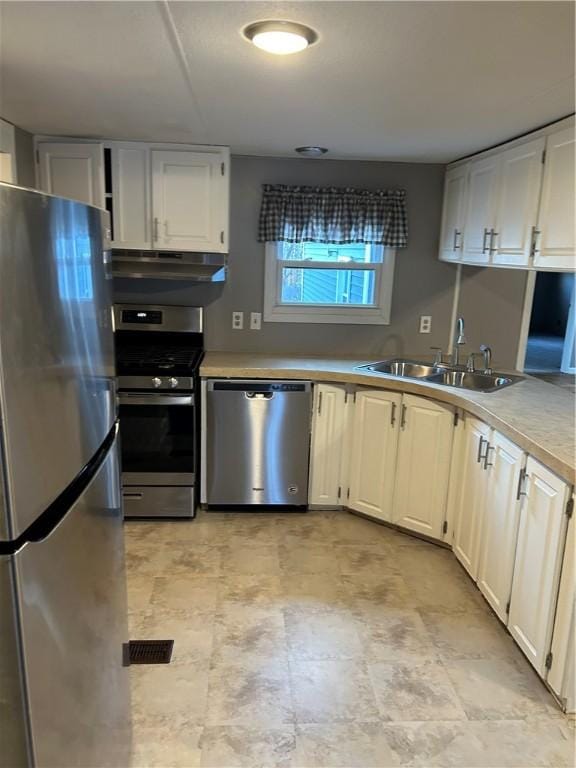 kitchen featuring white cabinets, sink, and appliances with stainless steel finishes