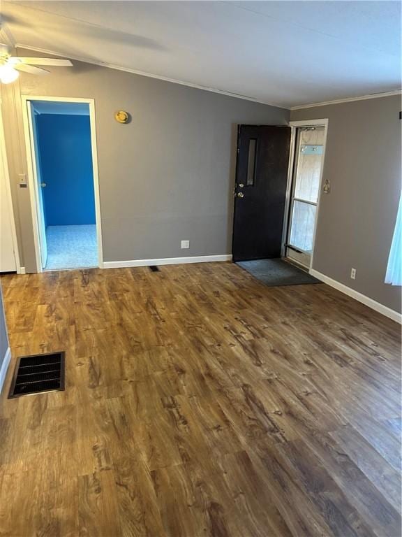 interior space with dark hardwood / wood-style floors, ceiling fan, and ornamental molding