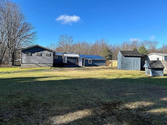 exterior space with a yard and a shed