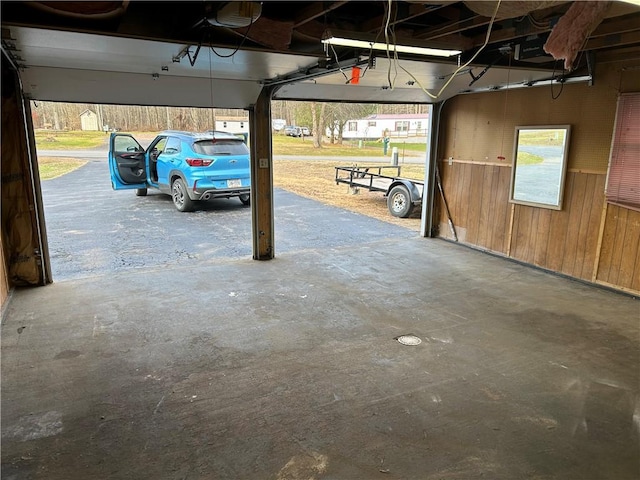 garage featuring wooden walls