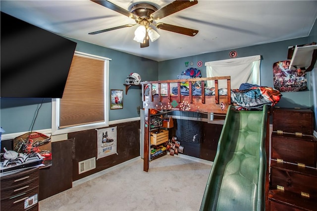 bedroom with ceiling fan and light colored carpet