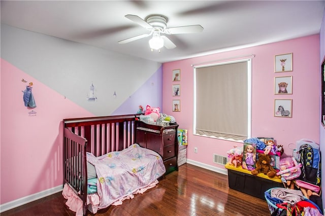 bedroom featuring ceiling fan and dark hardwood / wood-style flooring