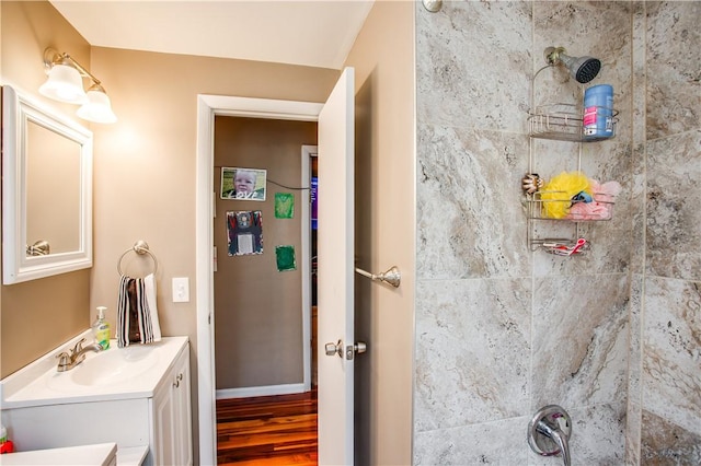 bathroom featuring vanity and hardwood / wood-style flooring