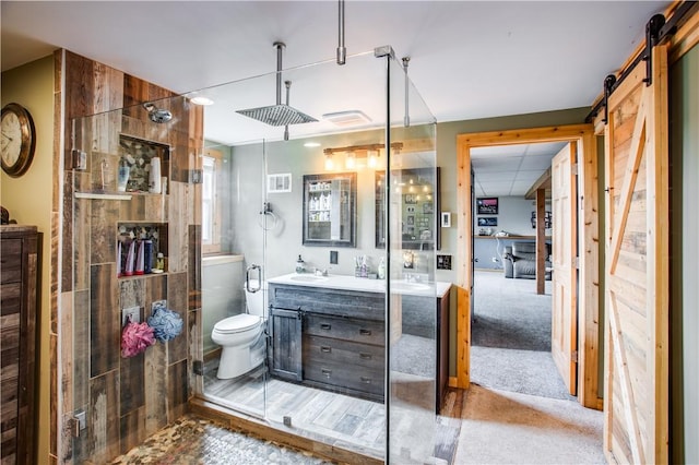 bathroom with vanity, toilet, and walk in shower