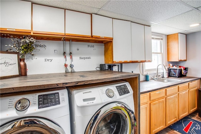 laundry area with independent washer and dryer, dark hardwood / wood-style floors, and sink