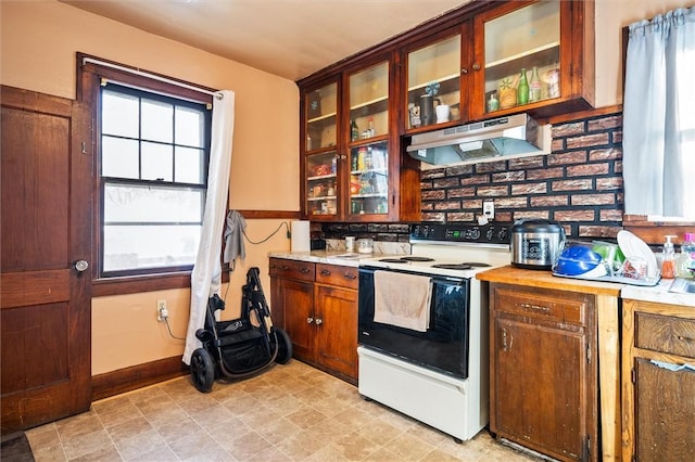 kitchen with white range with electric stovetop and ventilation hood