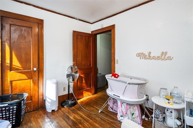 bathroom with hardwood / wood-style floors and ornamental molding