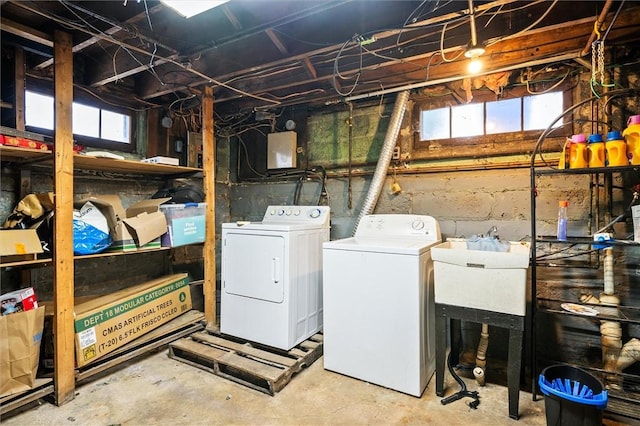 clothes washing area with separate washer and dryer