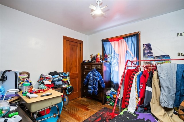 bedroom featuring ceiling fan and wood-type flooring