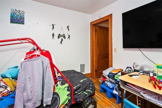 bedroom featuring hardwood / wood-style floors