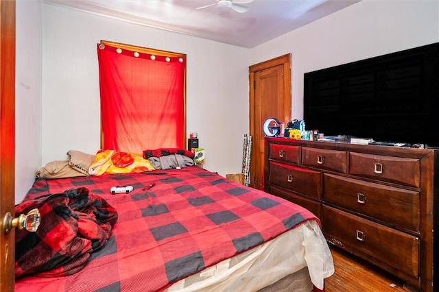 bedroom featuring hardwood / wood-style floors and ceiling fan