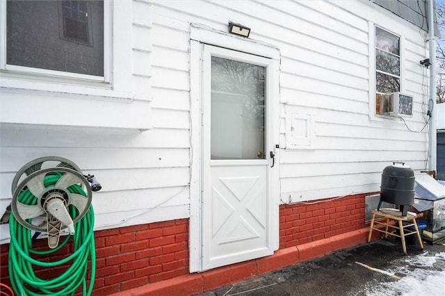 property entrance featuring cooling unit